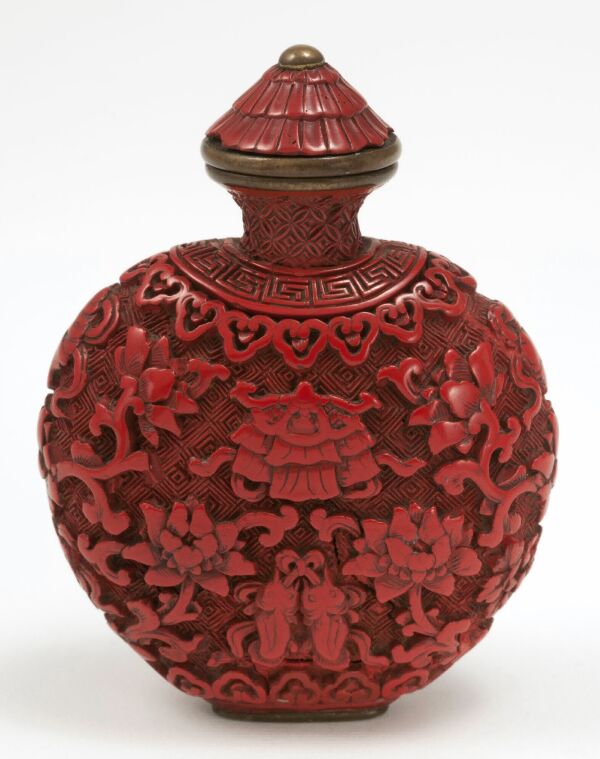 Cinnabar lacquer of spade form carved with flowers