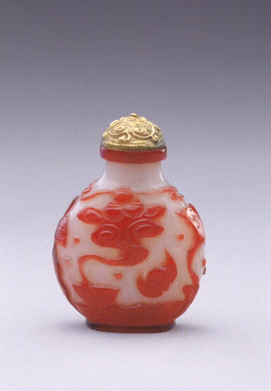 Red overlay on white glass with cranes, bats, and pavilion above waves