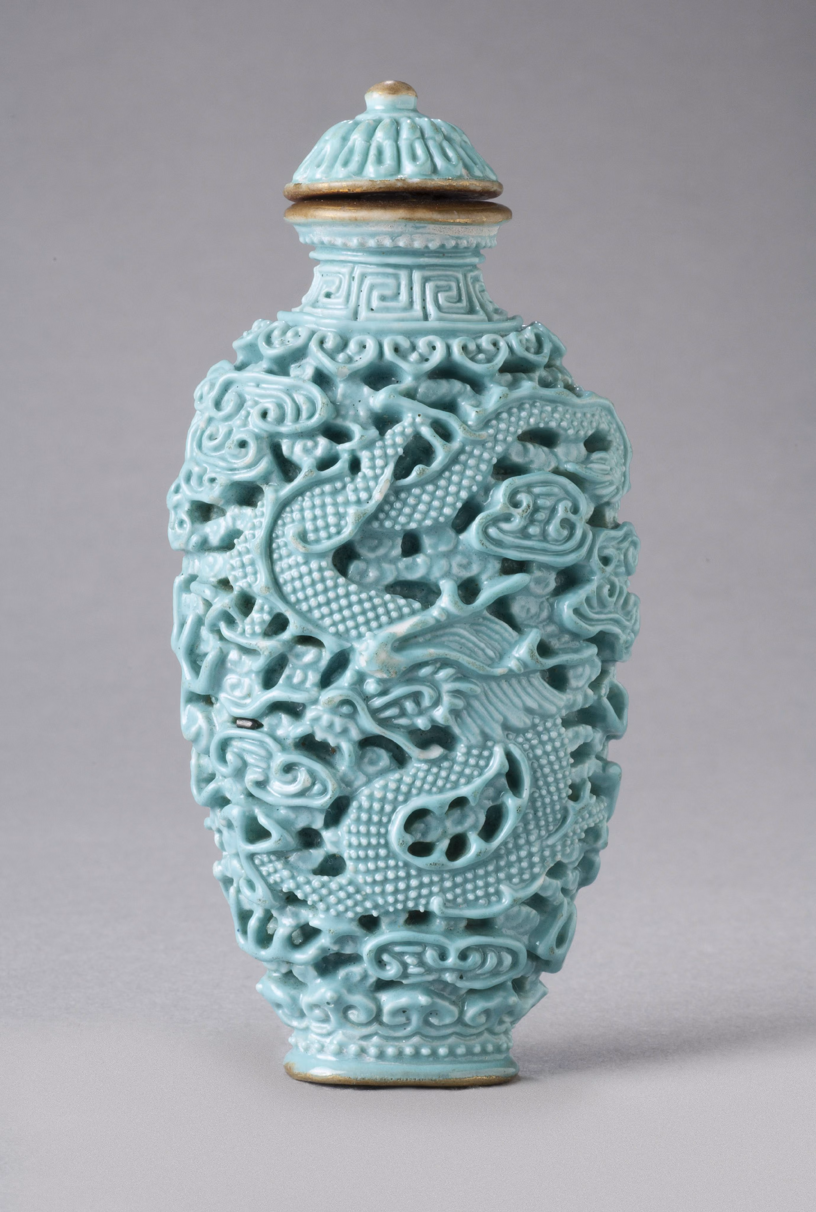Reticulated blue-glazed porcelain with dragon among clouds