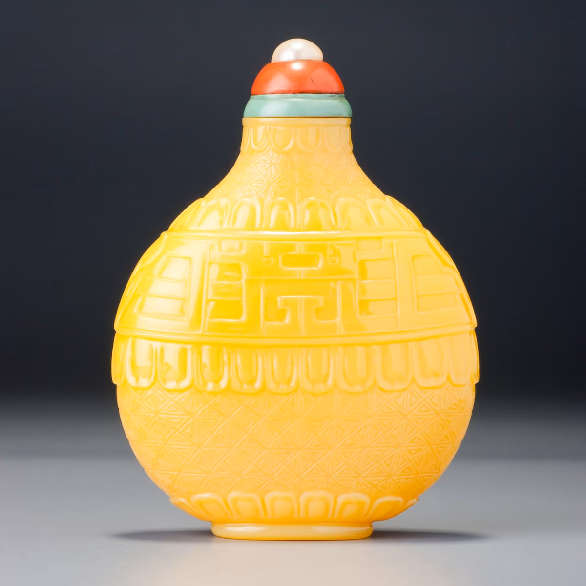 Imperial yellow carved glass snuff bottle