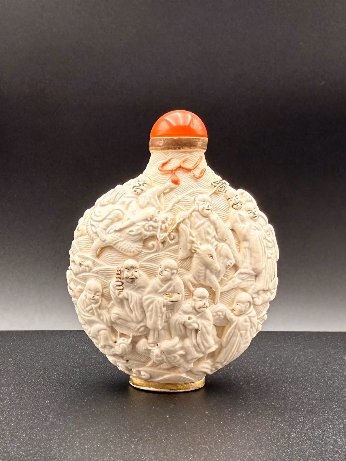 Imperial white-glazed porcelain moulded with eighteen Luohans
