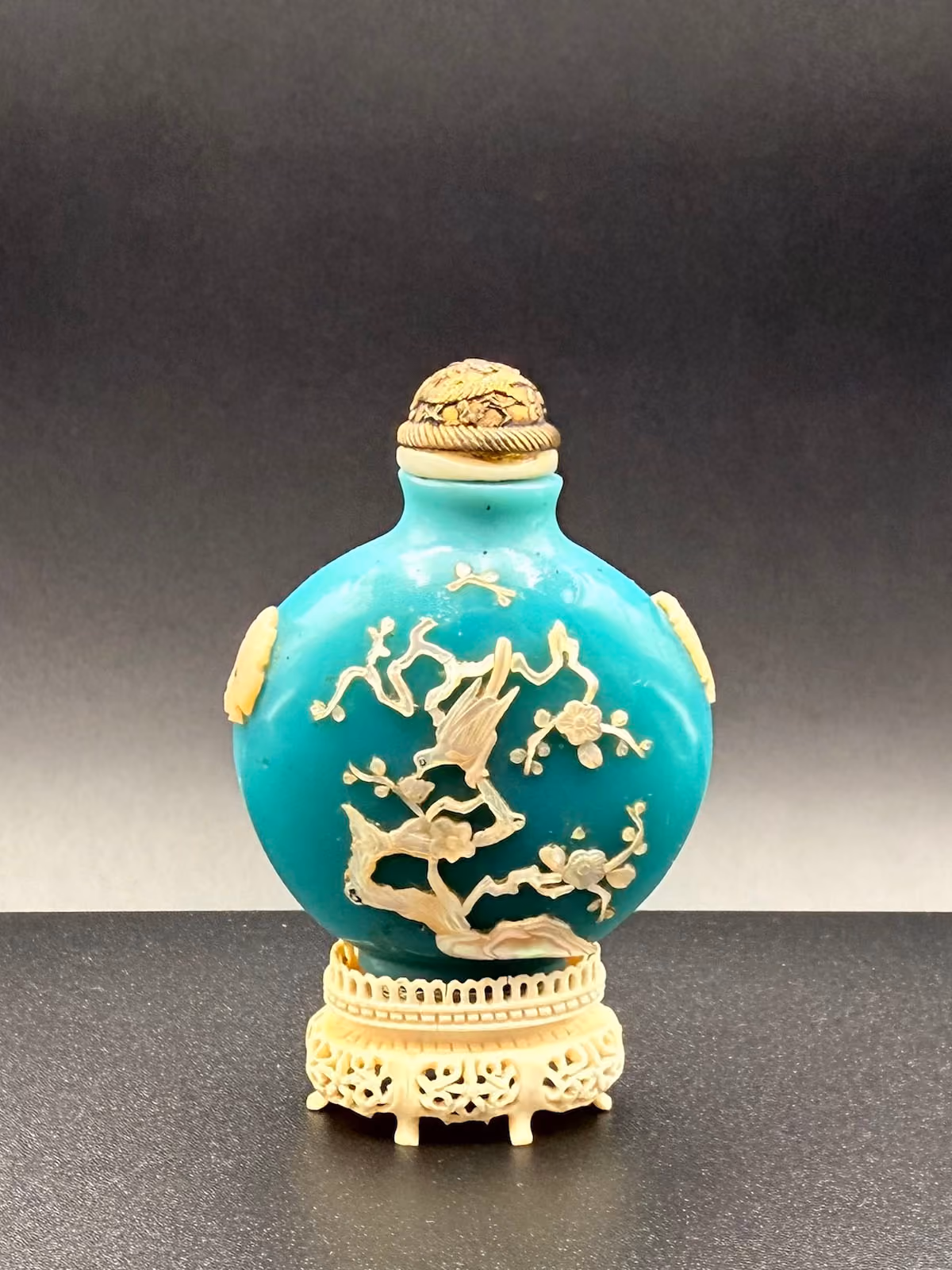 Turquoise blue glass embellished with mother-of-pearl garden landscape
