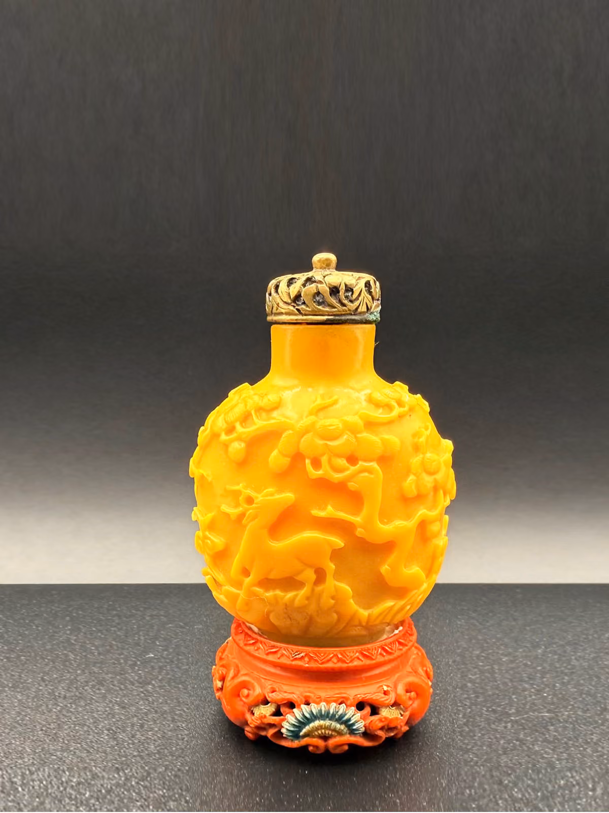 Imperial yellow glass carved with crane, deer, and pine