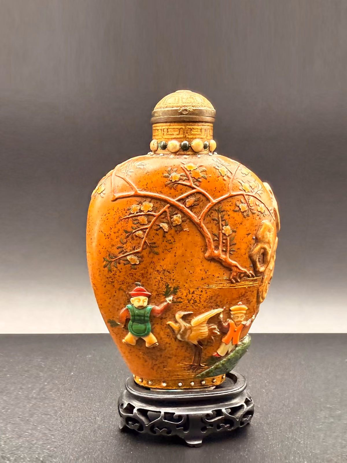 Embellished lacquer on metal with court ladies and dwarfs