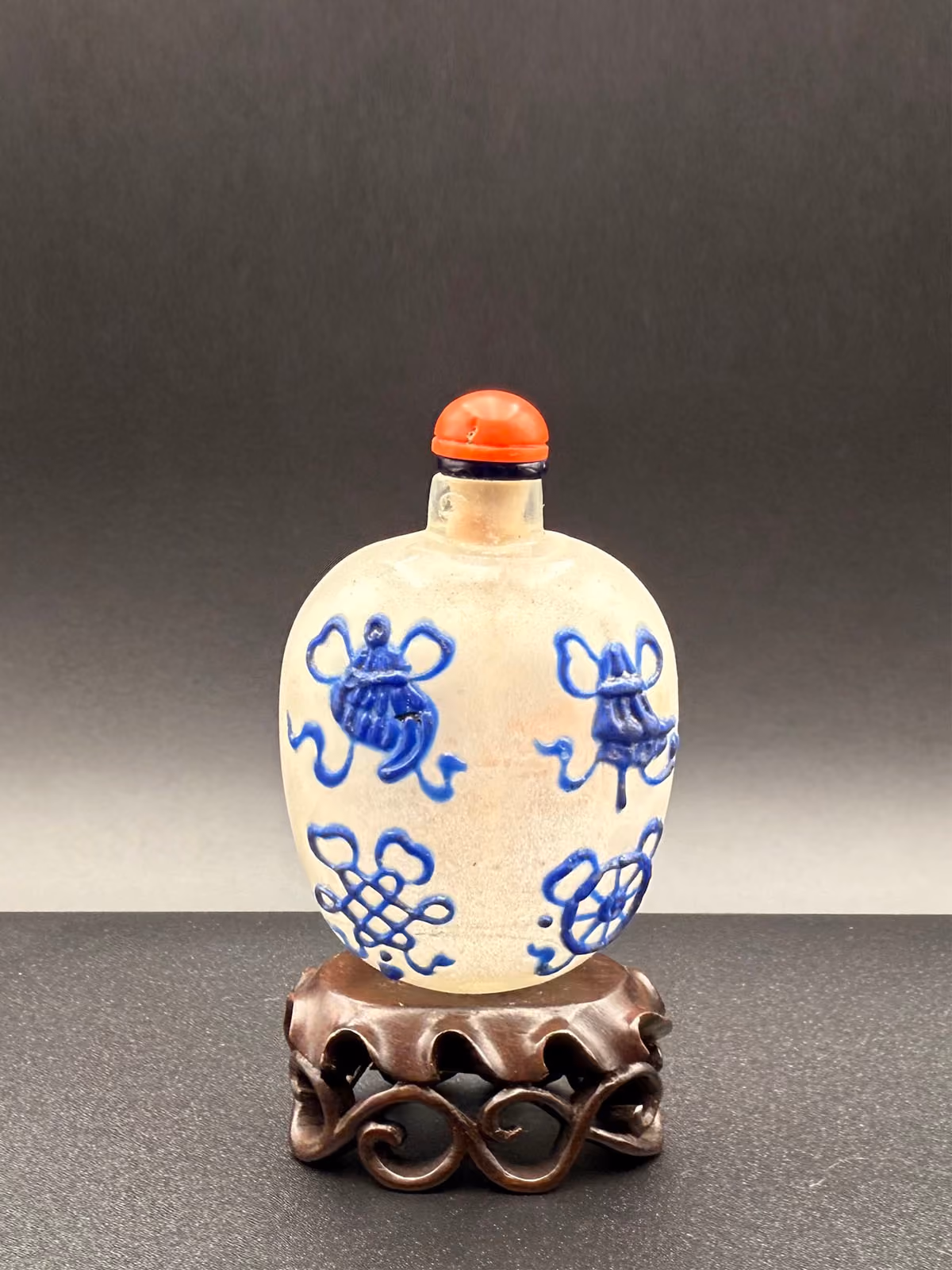 Blue enamel on camphor glass with eight Buddhist emblems