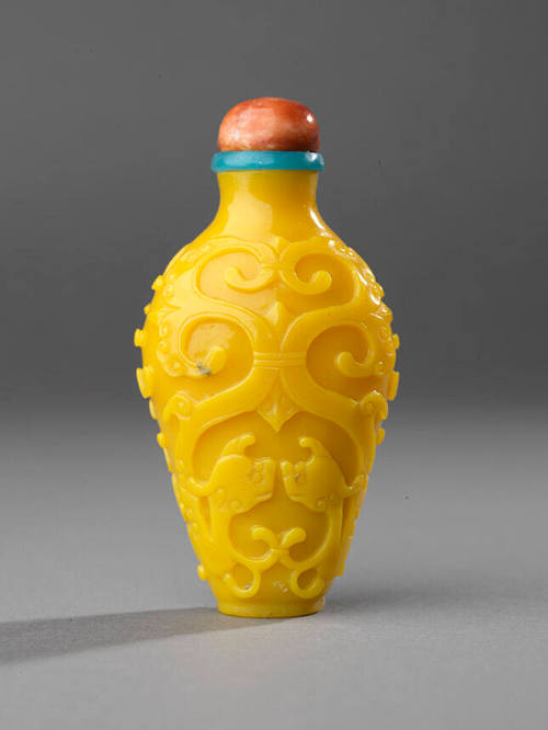 Carved glass with archaic confronting dragons