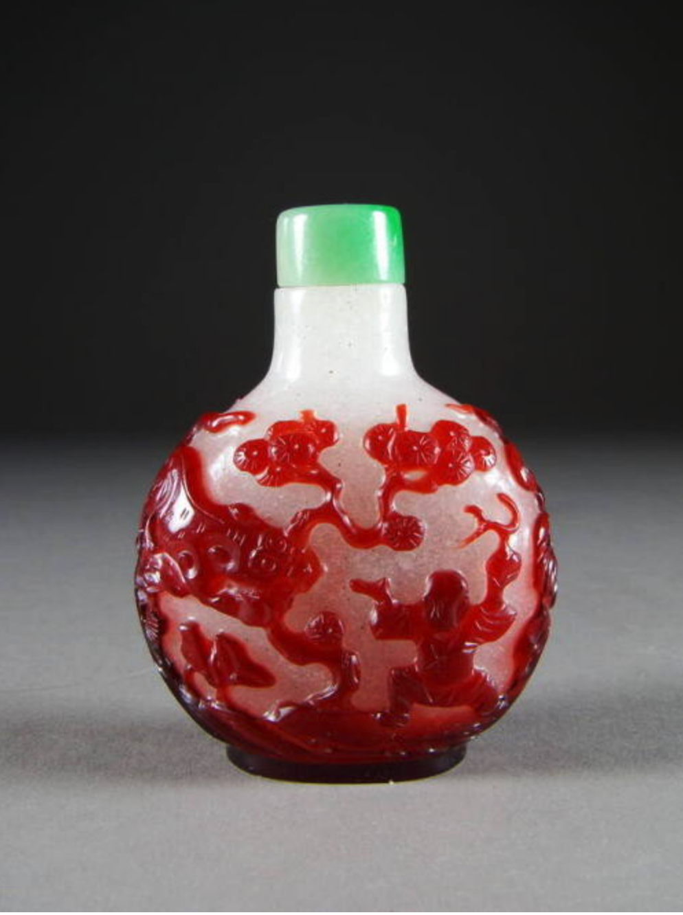 Red overlay on snowflake glass with dragon pursuing flaming pearl and tiger in landscape