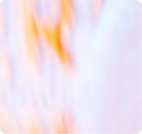 Abstract blurred background with pastel shades of purple, pink, and orange.