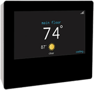 Digital thermostat displaying a temperature of 74 degrees Fahrenheit on the main floor with a clear weather icon and outside temperature of 87 degrees.