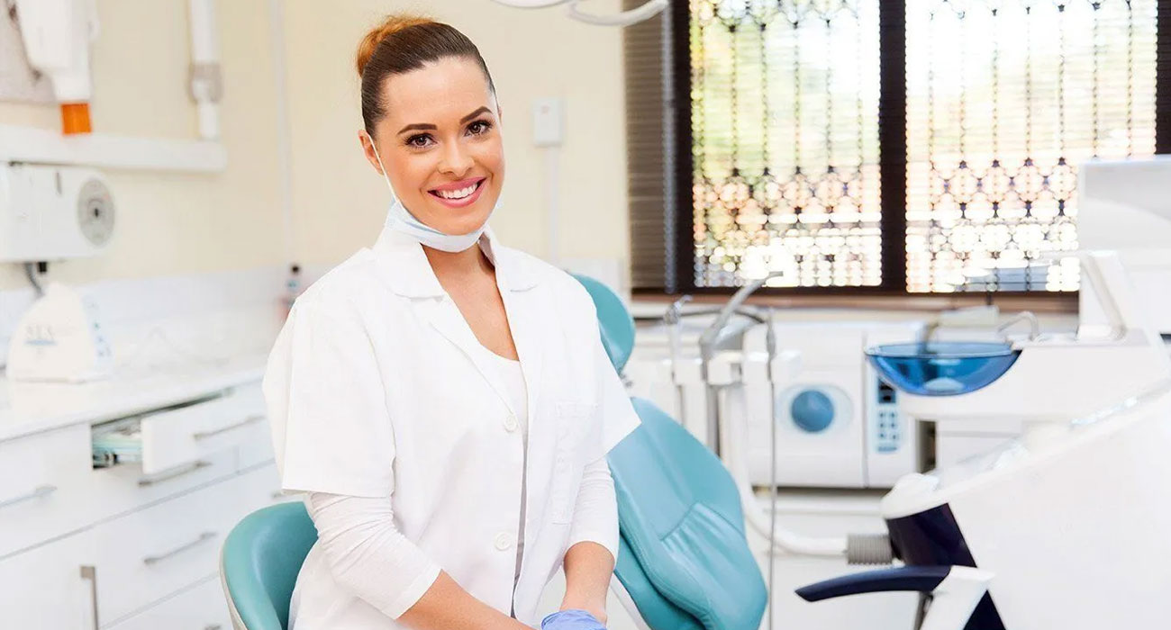 Dental practitioner in a treatment room at Stoneleigh Surgery
