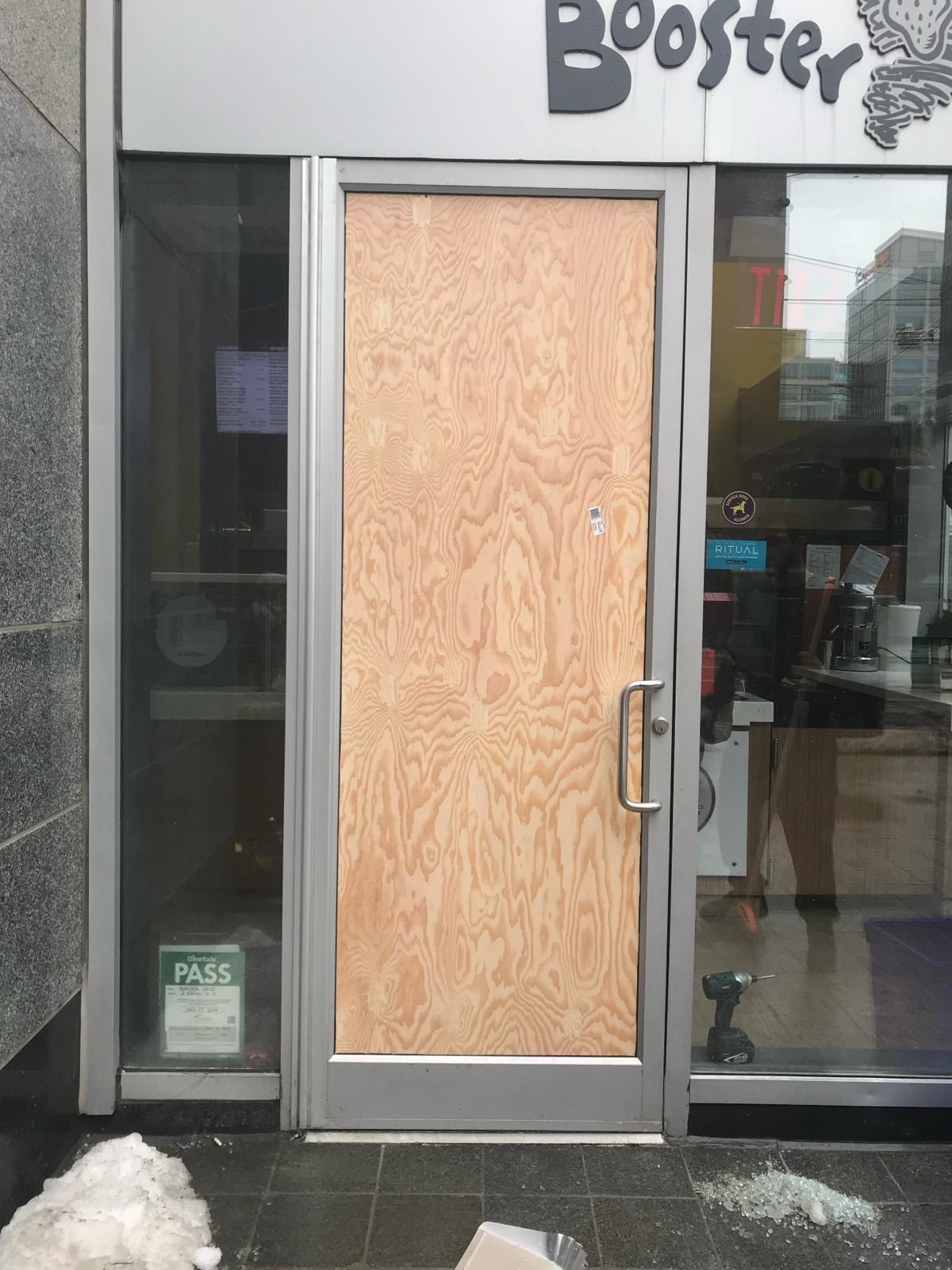 Commercial door board-up with plywood panel