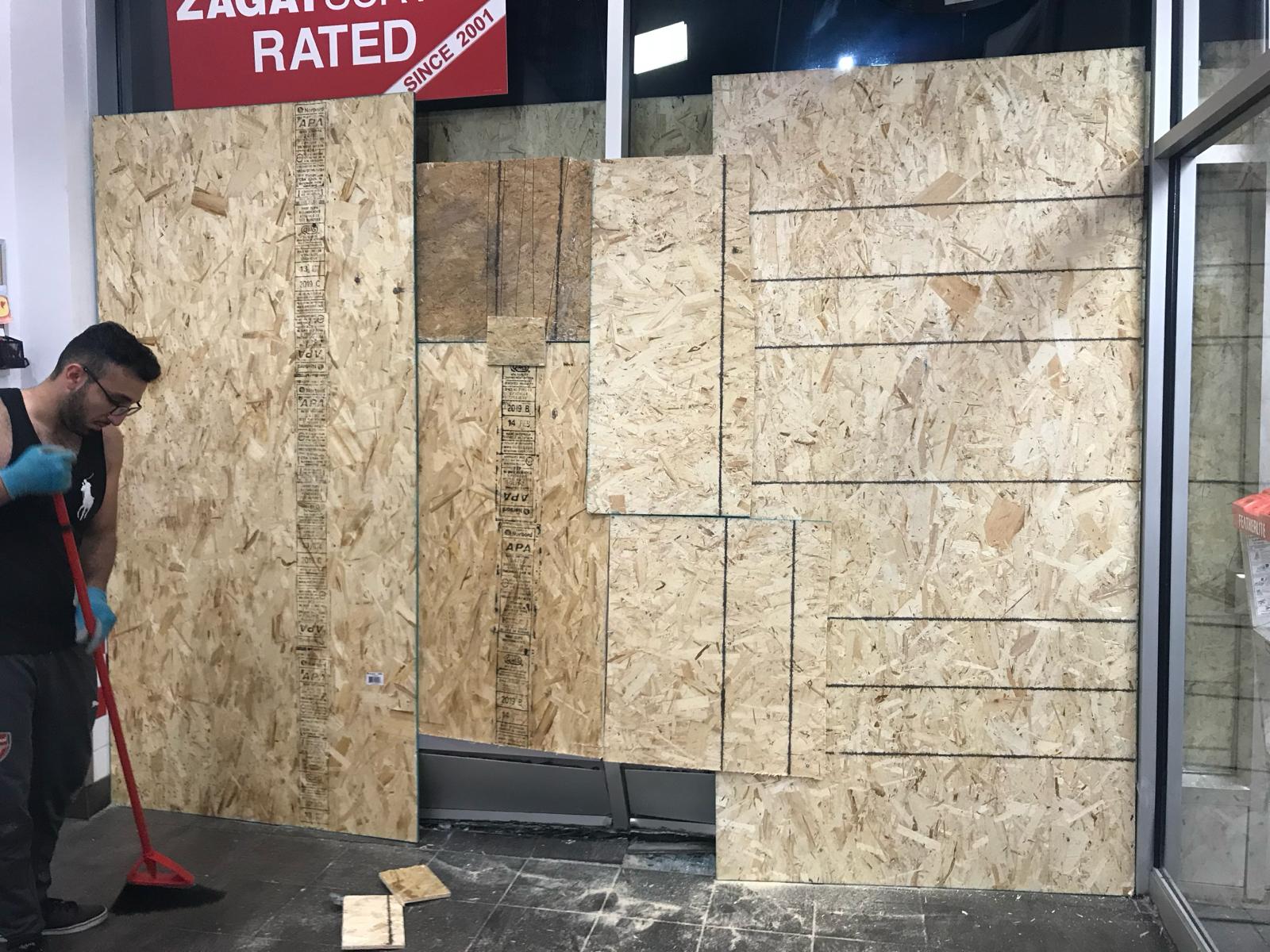 Commercial storefront board-up with plywood panel