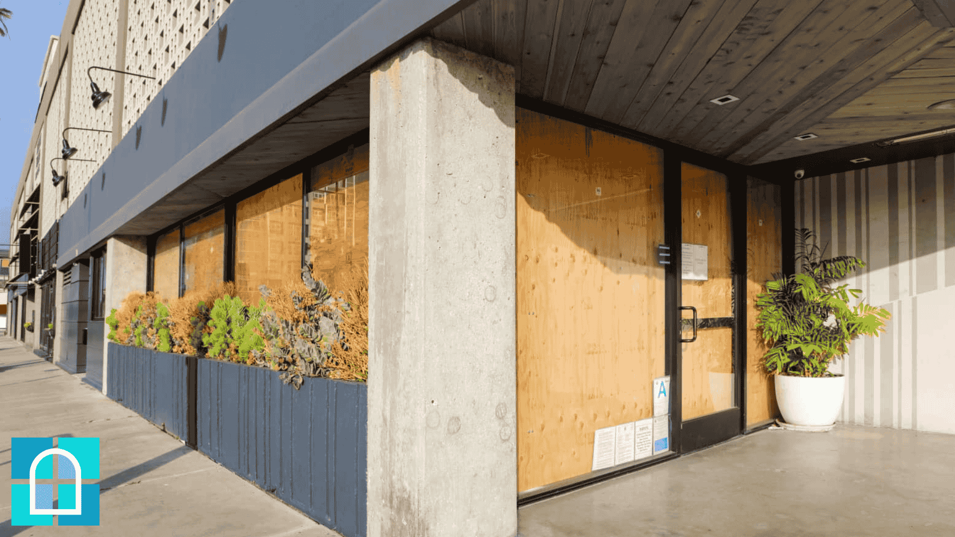 Replacement of a large tempered glass panel during emergency repair at a Toronto business property.