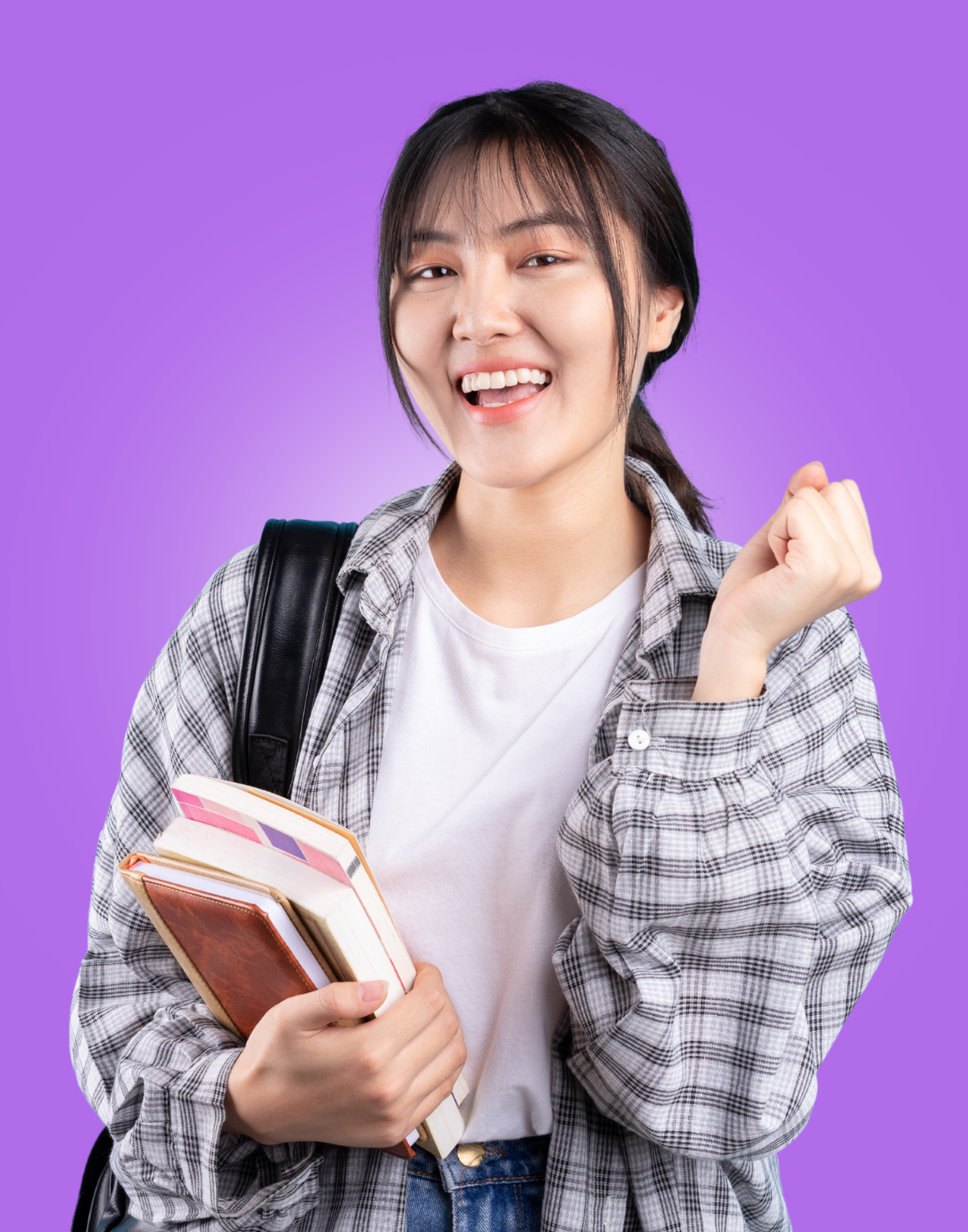 Happy student holding book