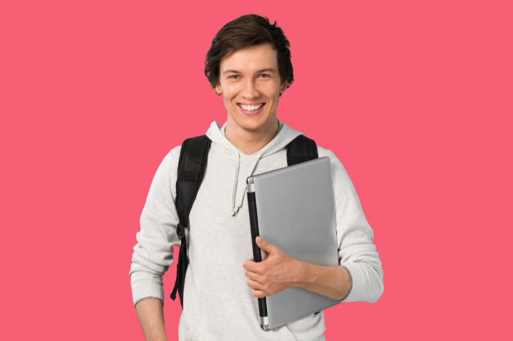 Student holding laptop