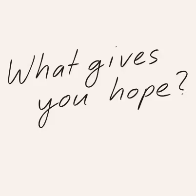 Handwritten text saying 'What gives you hope?' in black ink on a beige background.