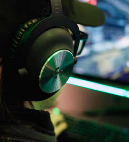 Gaming headset with green RGB lighting representing gaming and streaming creator content sales.