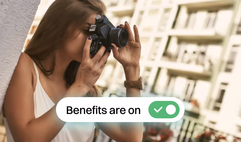 Woman taking a photo with a camera next to a Benefits are on toggle switched to active.