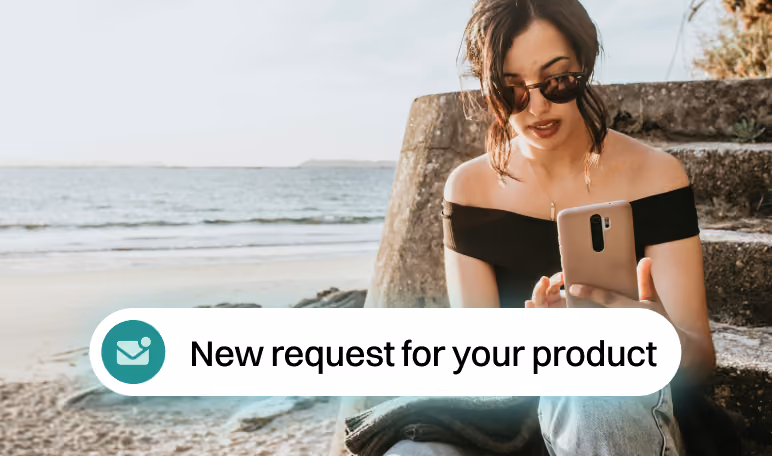 Woman checking her phone outdoors as a new product request notification arrives.