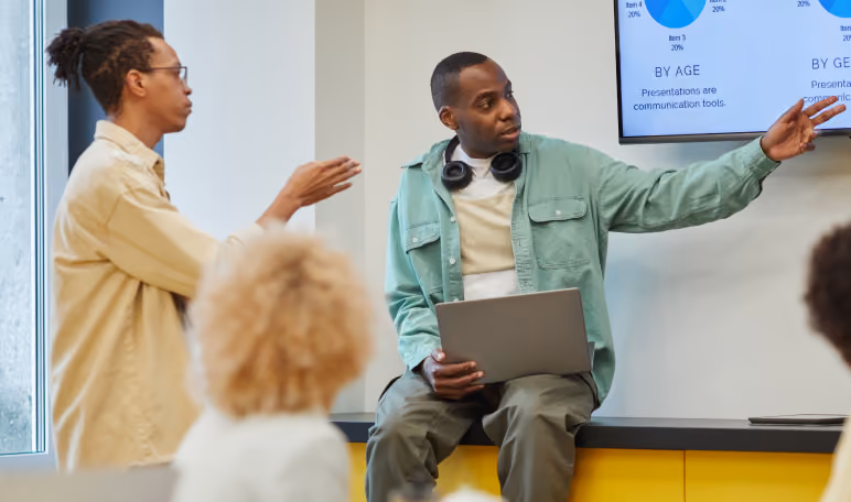 Team member presenting a new product launch plan to colleagues in a meeting