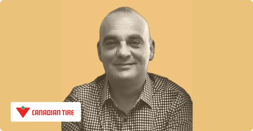 Smiling woman with long hair wearing a denim jacket against a light orange background with DFTBA logo in the lower left corner.