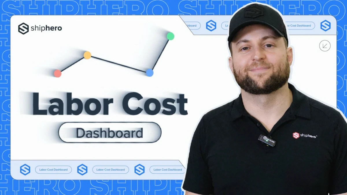Man in black Shiphero shirt and cap stands beside a screen showing a Labor Cost Dashboard graph.