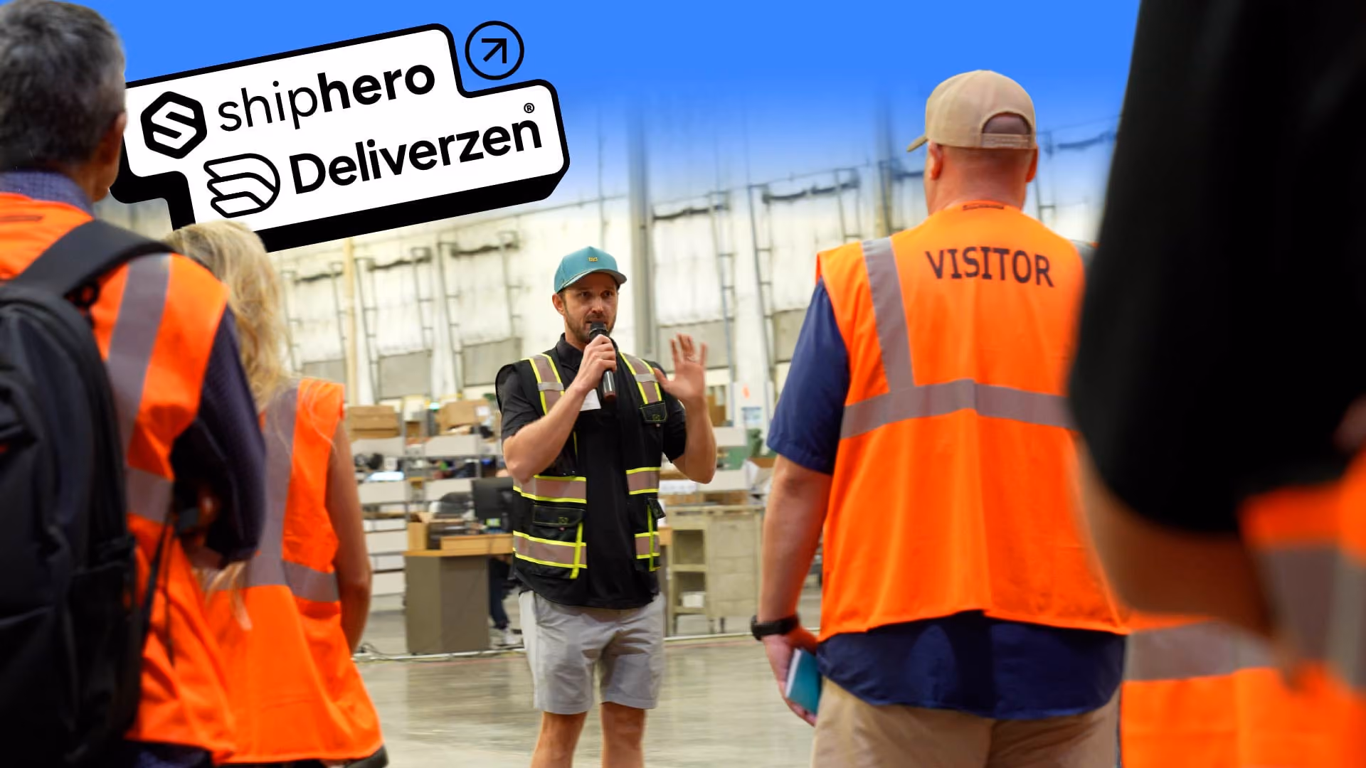 Deliverzen team leading a warehouse tour for visitors