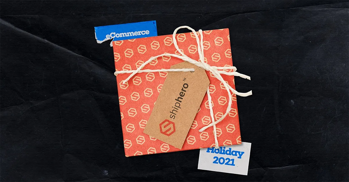 Red gift box with Shiphero logo and string, labeled Holiday 2021 and eCommerce on black background.