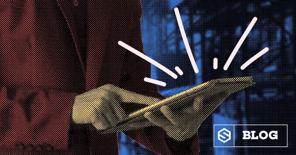 Person in red jacket using a tablet with graphic lines above screen, blog icon in corner.