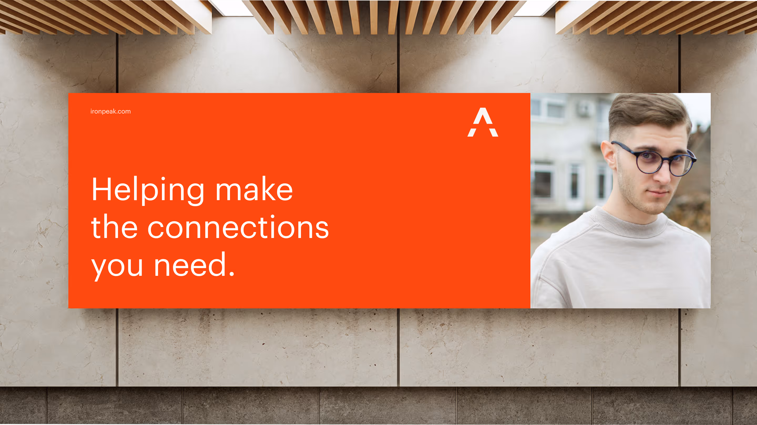 Photo of a billboard advertisement for Ironpeak. The message says, “Helping make the connections you need”.