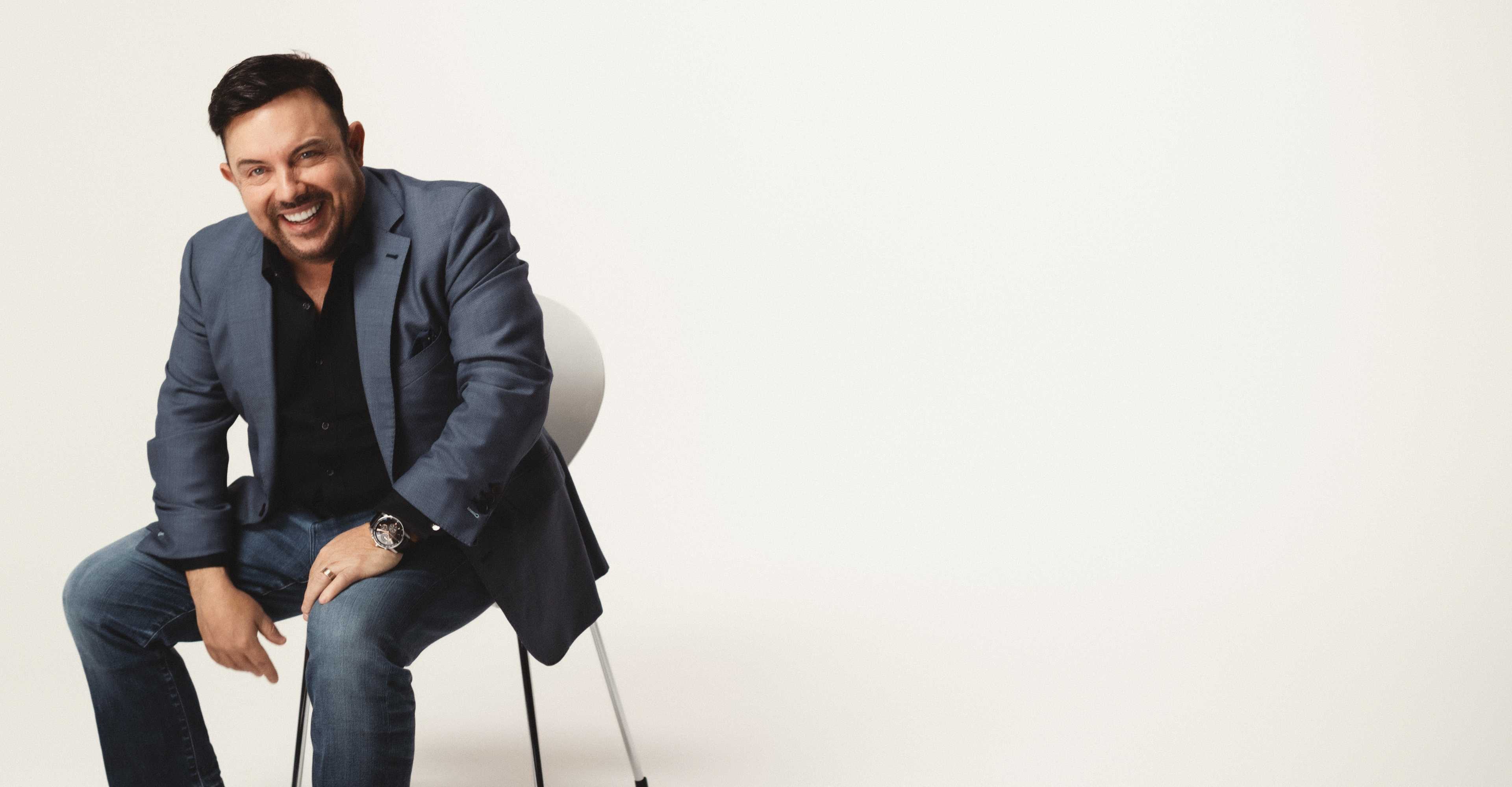 Dr. Michael Riccobene sitting on a chair