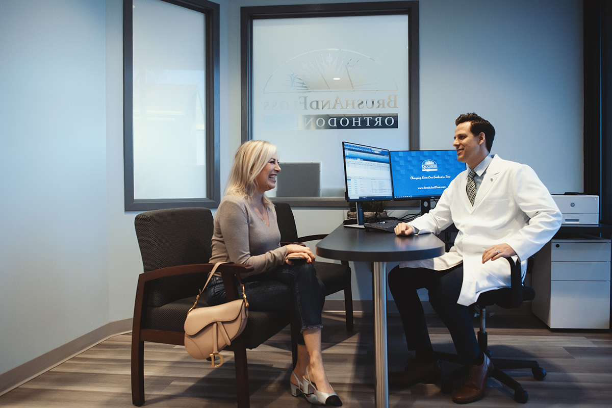 A patient talks with a dentist