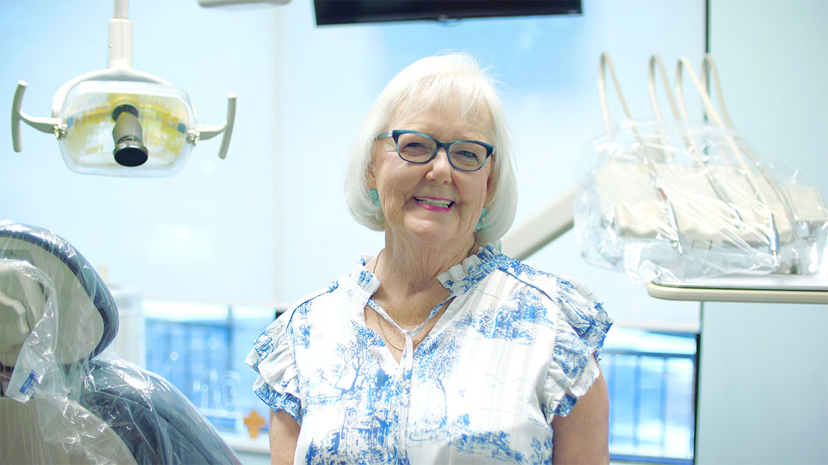 A photo of Janice King smiling in a dental office