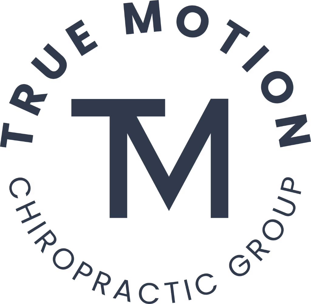 Logo with large letters 'TM' in the center and the text 'True Motion Chiropractic Group' curved around it.