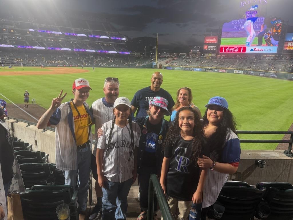 Sober AF group photo on the field at Coors Field after a Colorado Rockies win.