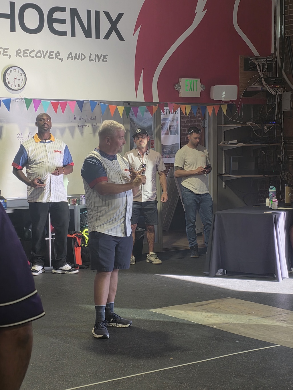 Sober AF community members gathered indoors at a Phoenix Recovery Center event.