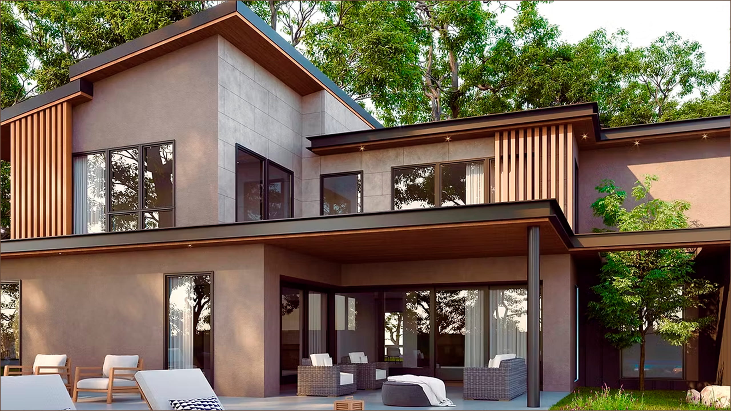 Modern two-story house with large windows, outdoor seating area with wicker chairs, and greenery.