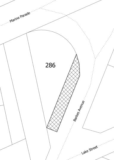 Aerial map showing outlines of roads, with a section coloured in to show the land for sale.