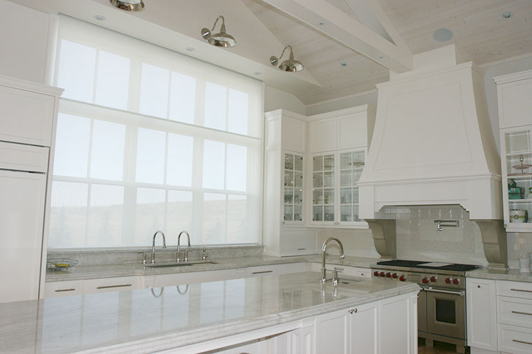 Large kitchen window with Lutron Shade