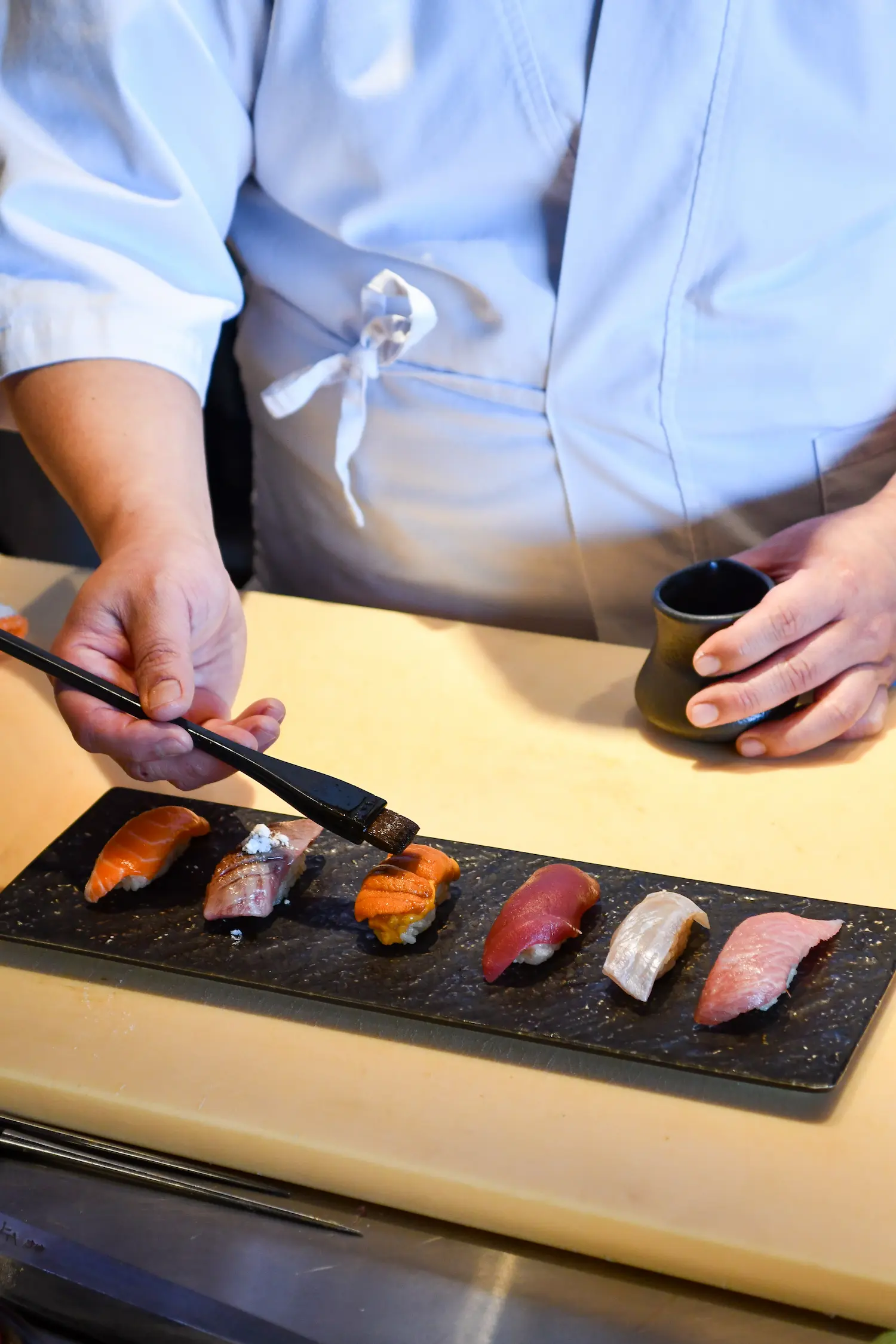 Chef finishing sushi