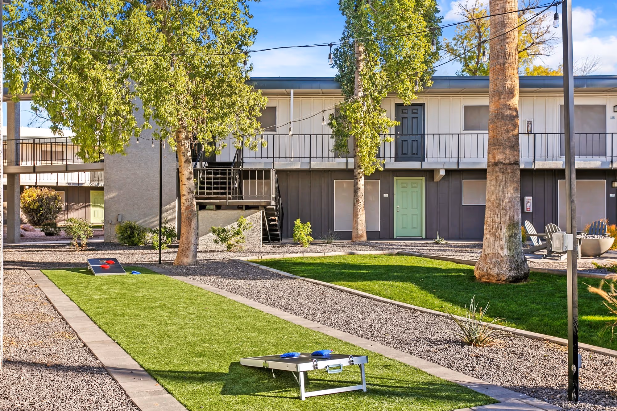 outdoor gaming area with corn hole game
