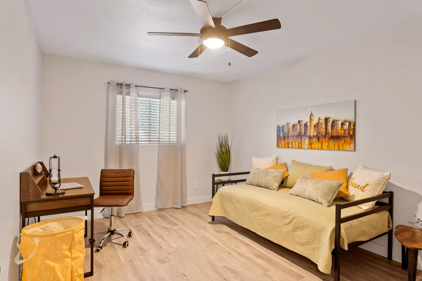Bedroom with daybed and desk with chair