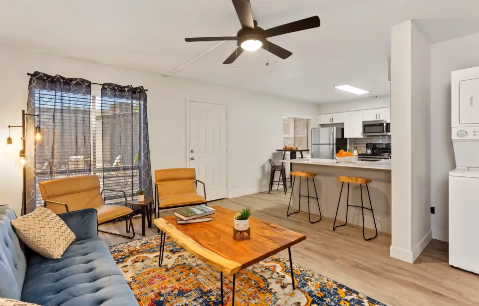 view of furnished living area, kitchen, and laundry room
