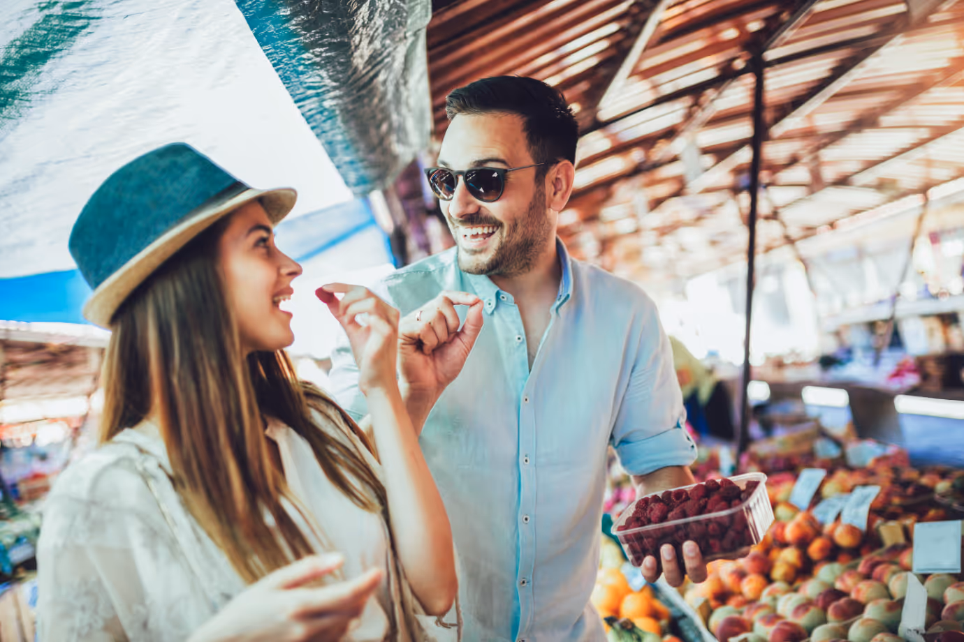 man and woman eating fruit stock image