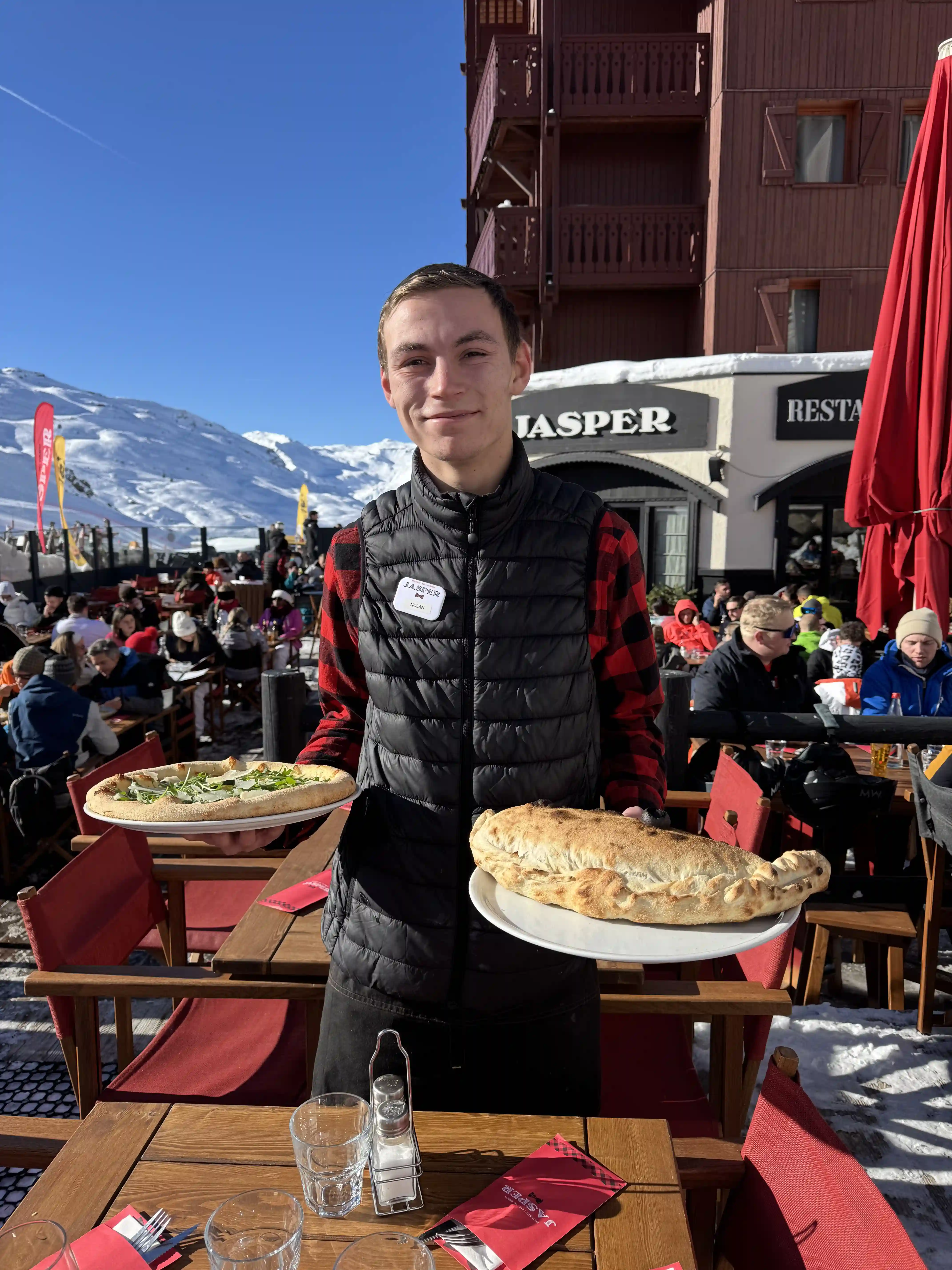Fresh plate consisting of crisp salad, vegetables, and golden tacos served at Jasper.