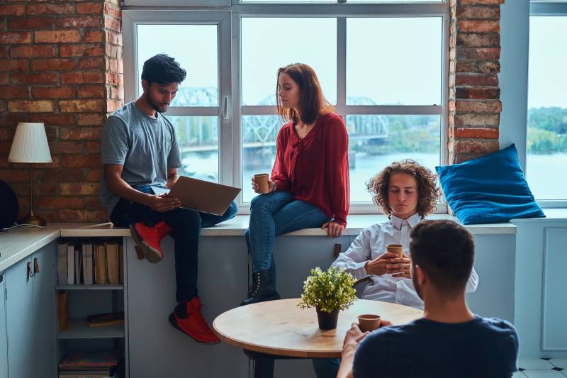 students hanging out in their shared apartment