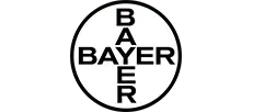 Logo firmy Bayer w kształcie okręgu z napisem Bayer w pionie i poziomie.