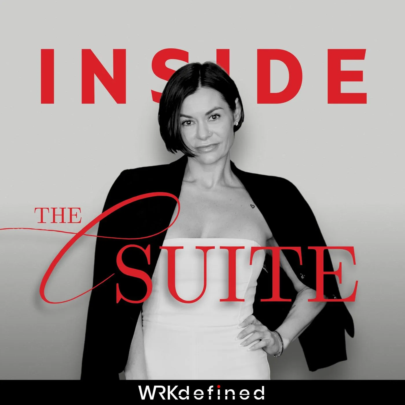 Black-and-white photo of a woman with short hair in a strapless top and dark jacket draped over her shoulders, with bold red text reading 'INSIDE THE SUITE'.