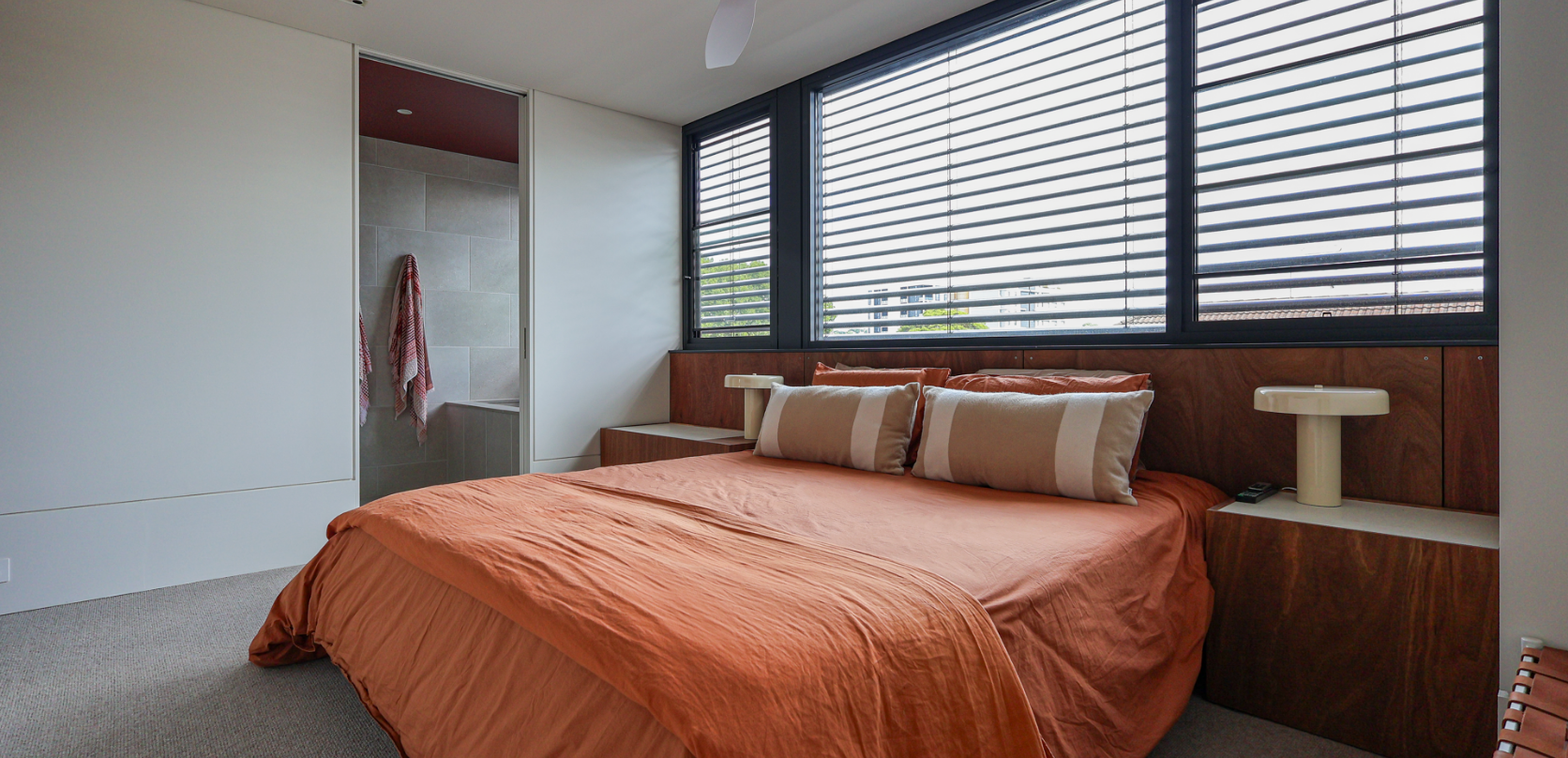 A light-filled bedroom knockdown rebuild with a calm, contemporary finish, designed to create a comfortable and cohesive private space.