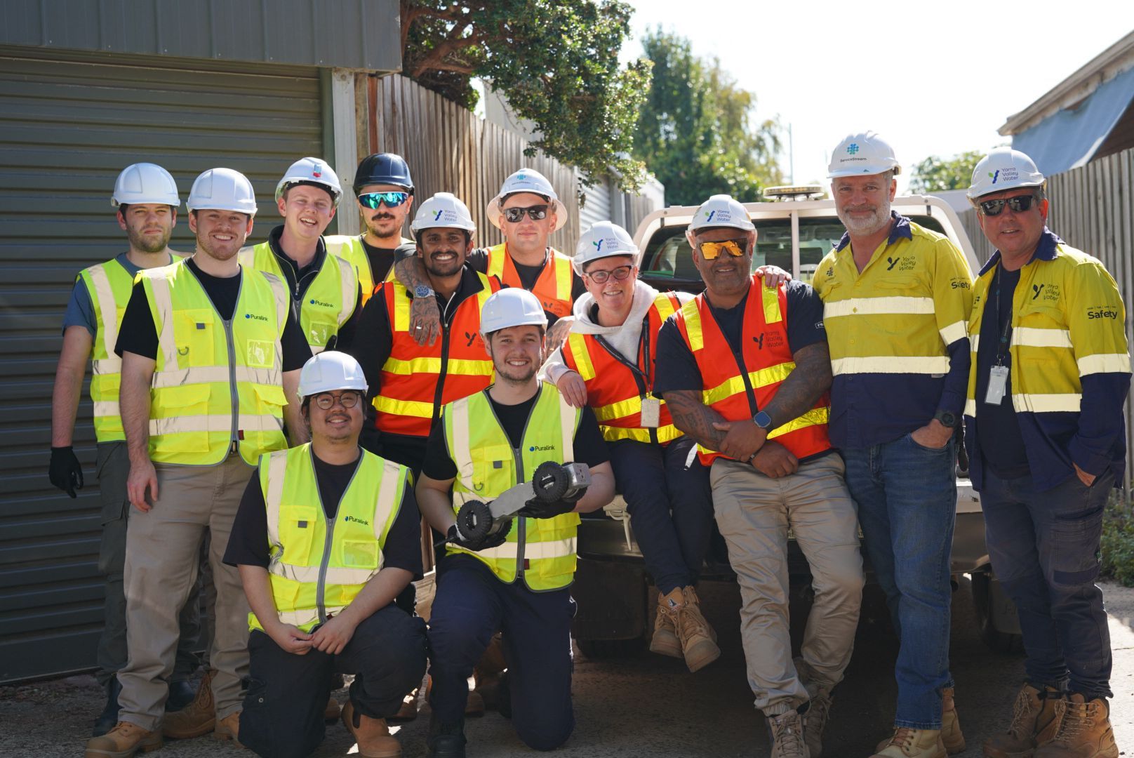 Puralink team and customer at a field deployment site with the Ferret robot